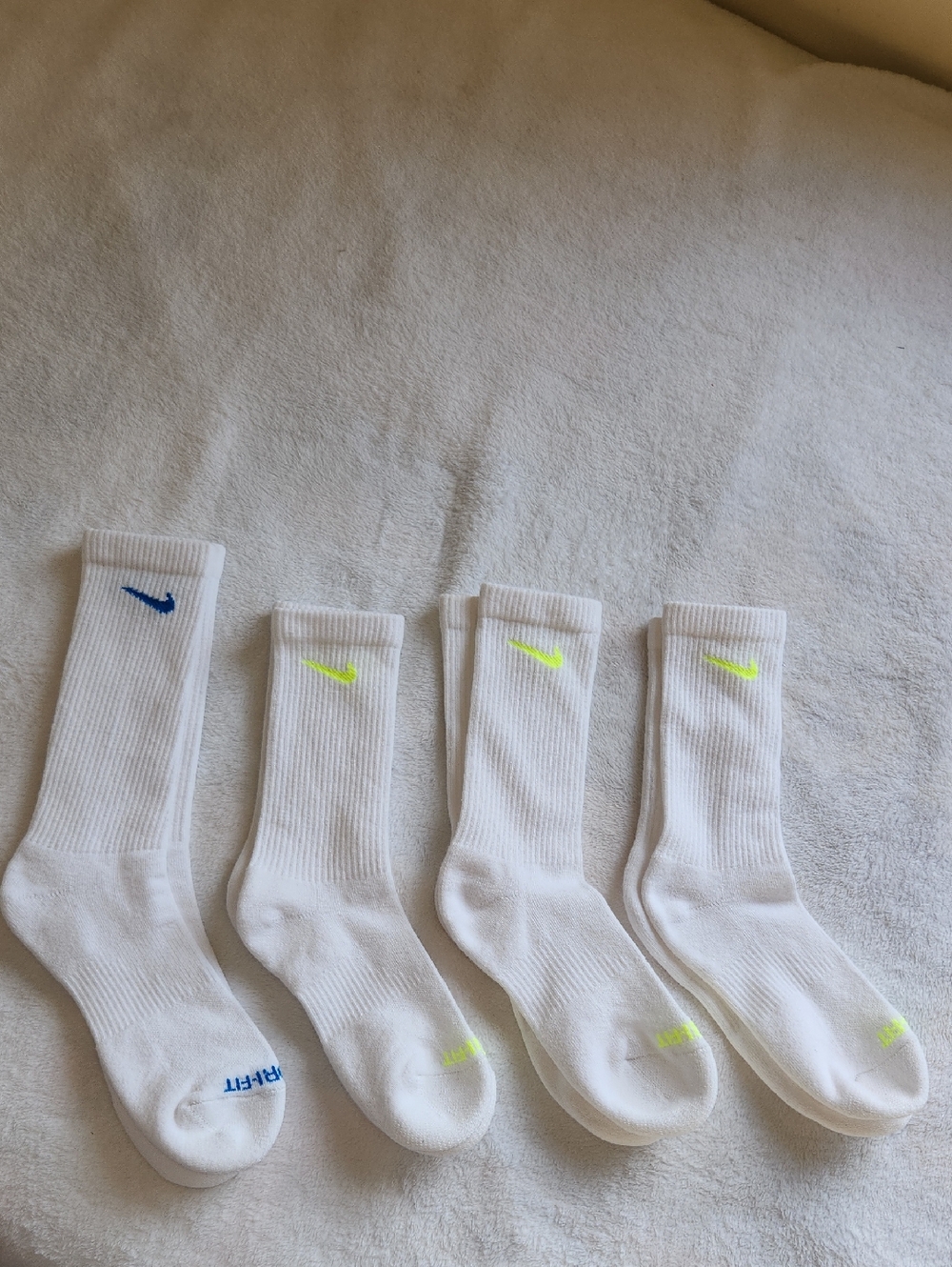Nike White Crew Athletic Socks with Blue and Neon Yellow Swooshes - 4 Pack